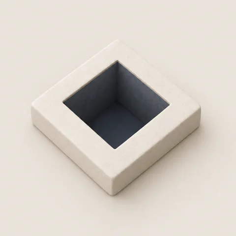 A stone tile with a deep, dark square pit in it.